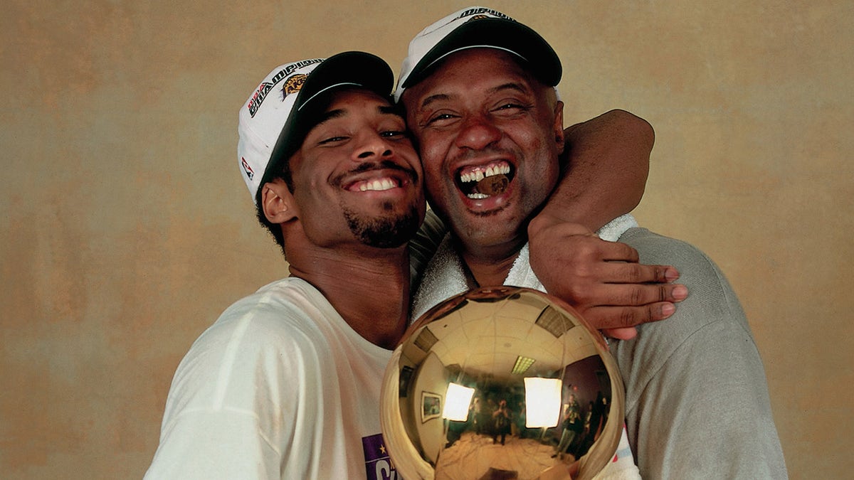Kobe Bryant hugs his dad Joe Bryant
