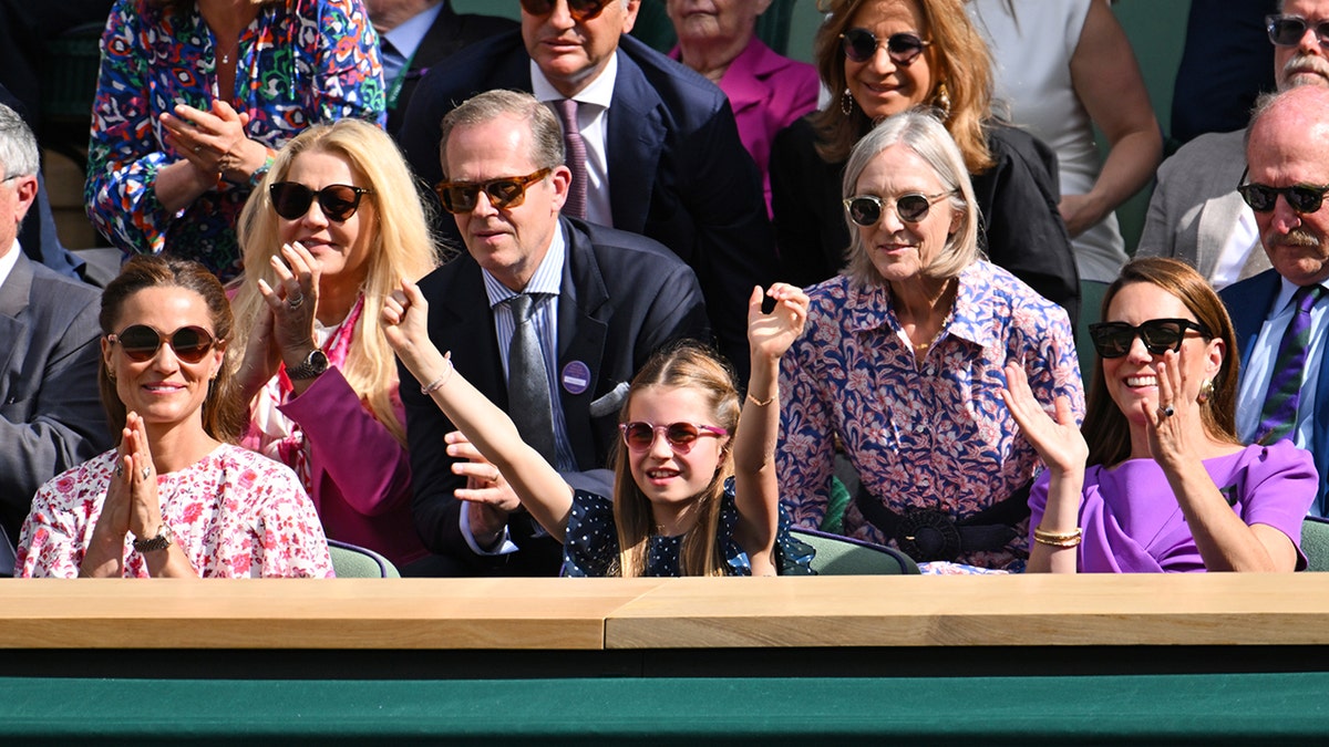 An animated Pippa Middleton, Princess Charlotte and Kate Middleton cheer at Wimbledon