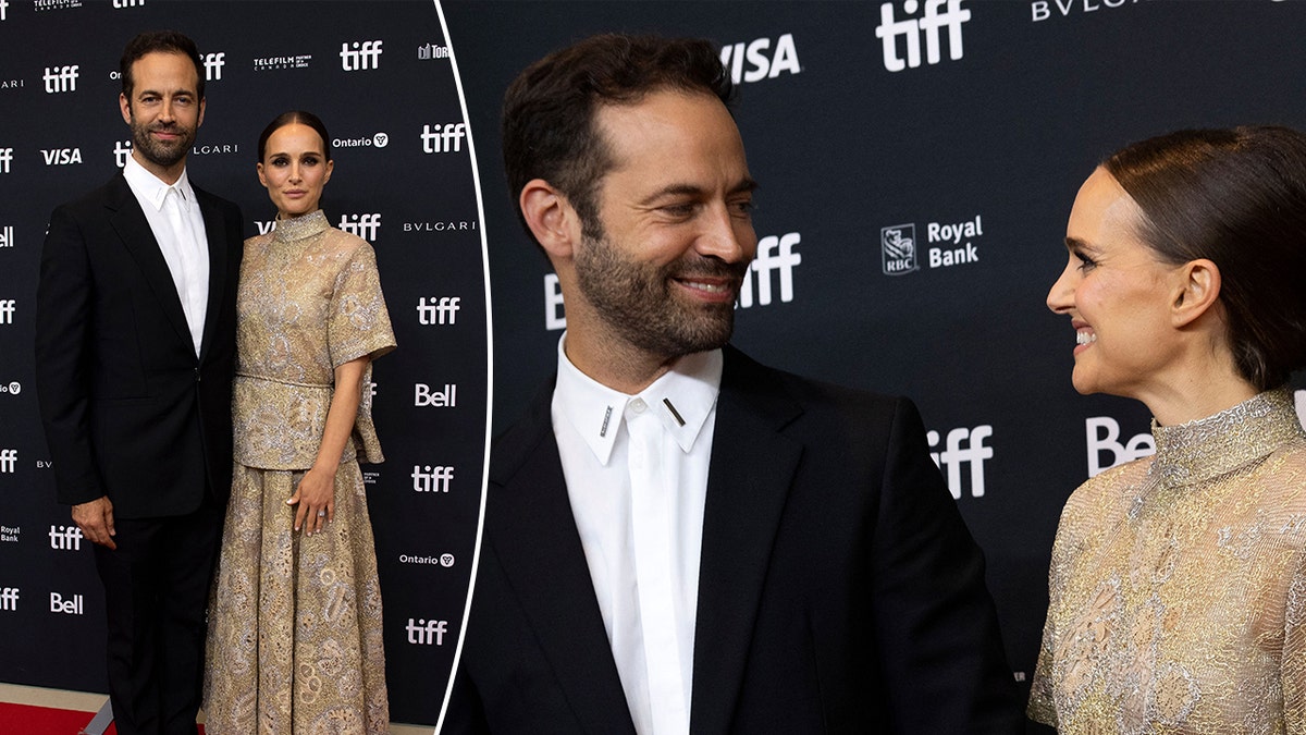 Benjamin Millepied in a black suit poses with wife Natalie Portman in a gold and silver two piece dress split the couple looks at each other adoringly at the same event