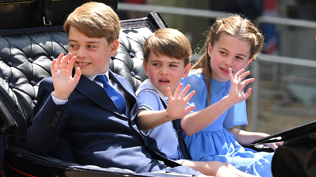 Prince George, Prince Louis and Princess Charlotte in a carriage at the Trooping the Colour in 2022.