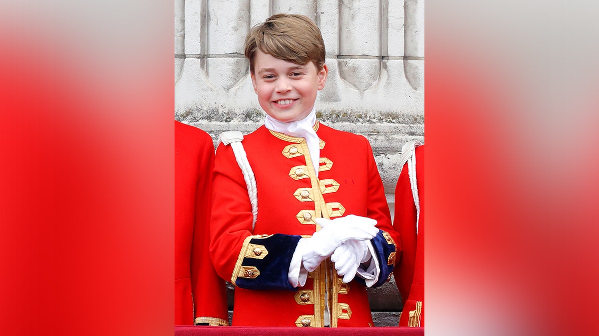 Prince George was all smiles dressed in red during King Charles III's coronation in May 2023.