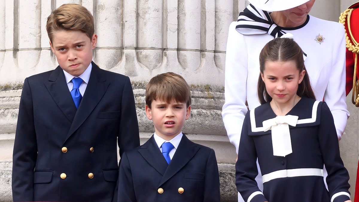 Prince George and Louis and Princess Charlotte all in navy outfits at the Trooping the Colour ceremony