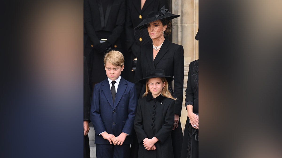 Prince George solemnly stood next to his mom and sister at Queen Elizabeth II's funeral.