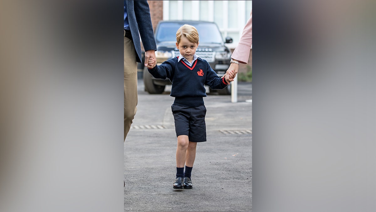 Prince George walked hand in hand with his dad, Prince William, on his first day of school.