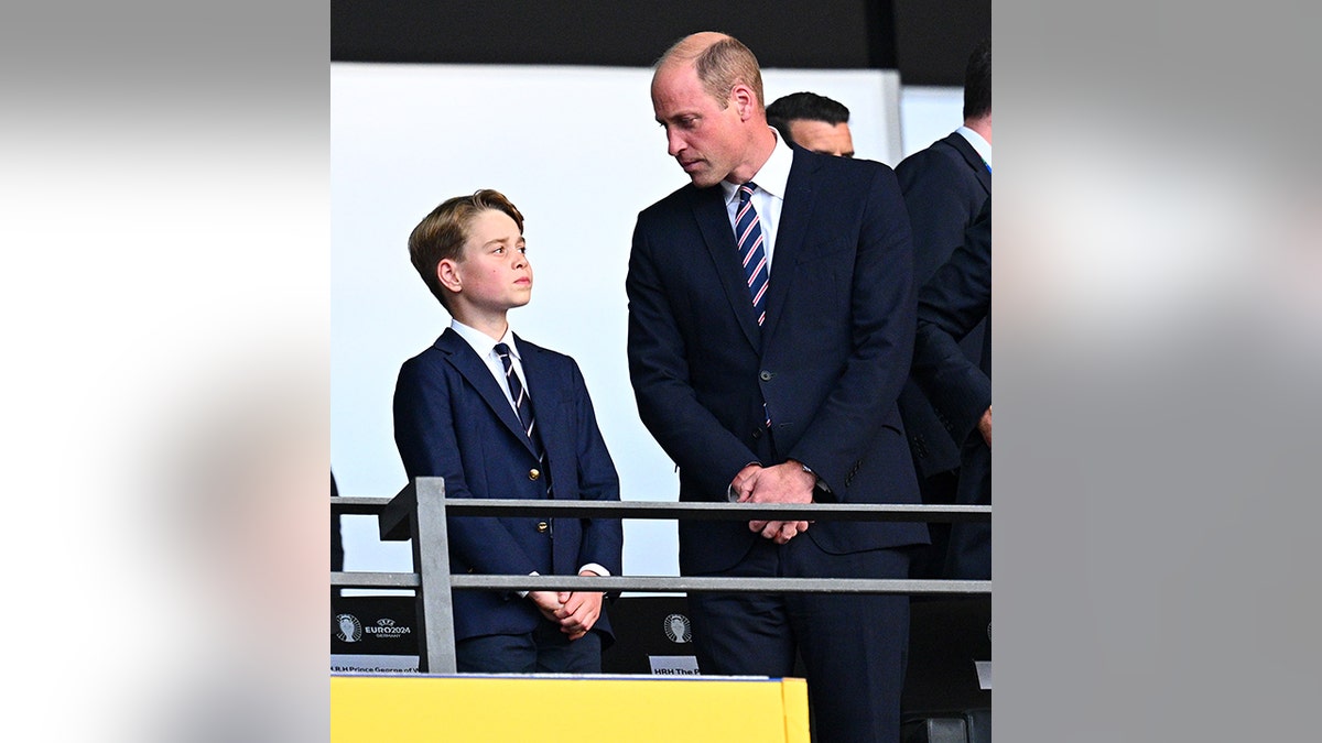 Prince George looks up at Prince William at the EFA Euro 2024 Championship