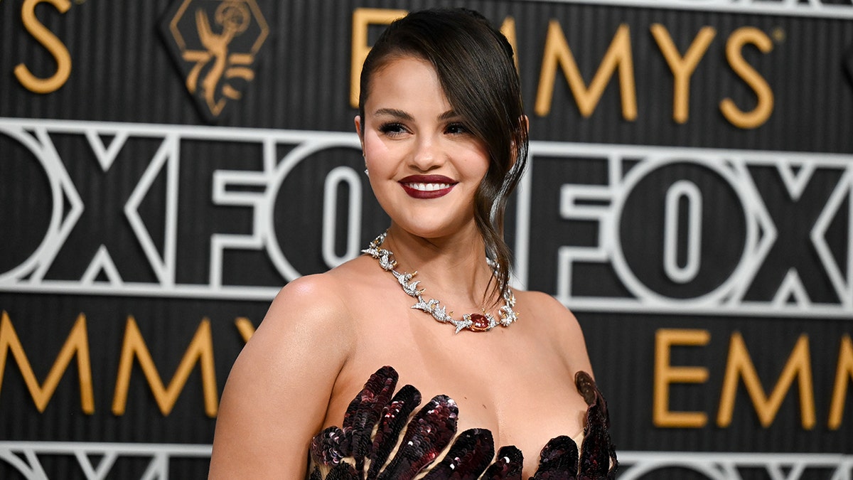 Selena Gomez in a plum strapless gown at the Emmy Awards