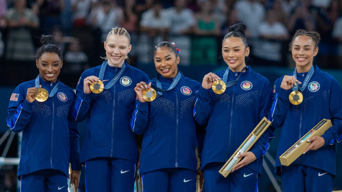 USA women's gymnastics team with gold medals