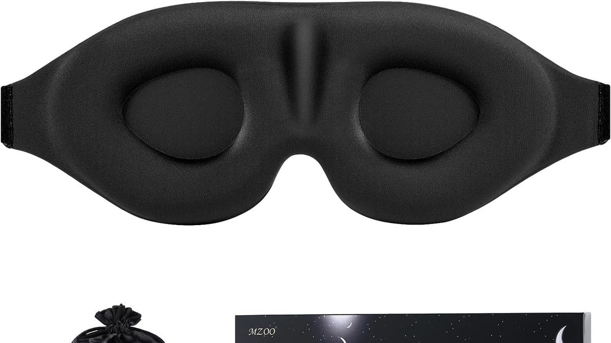 This sleep mask features a concave eye cup and a buckle strap to adjust it snuggly to your face.