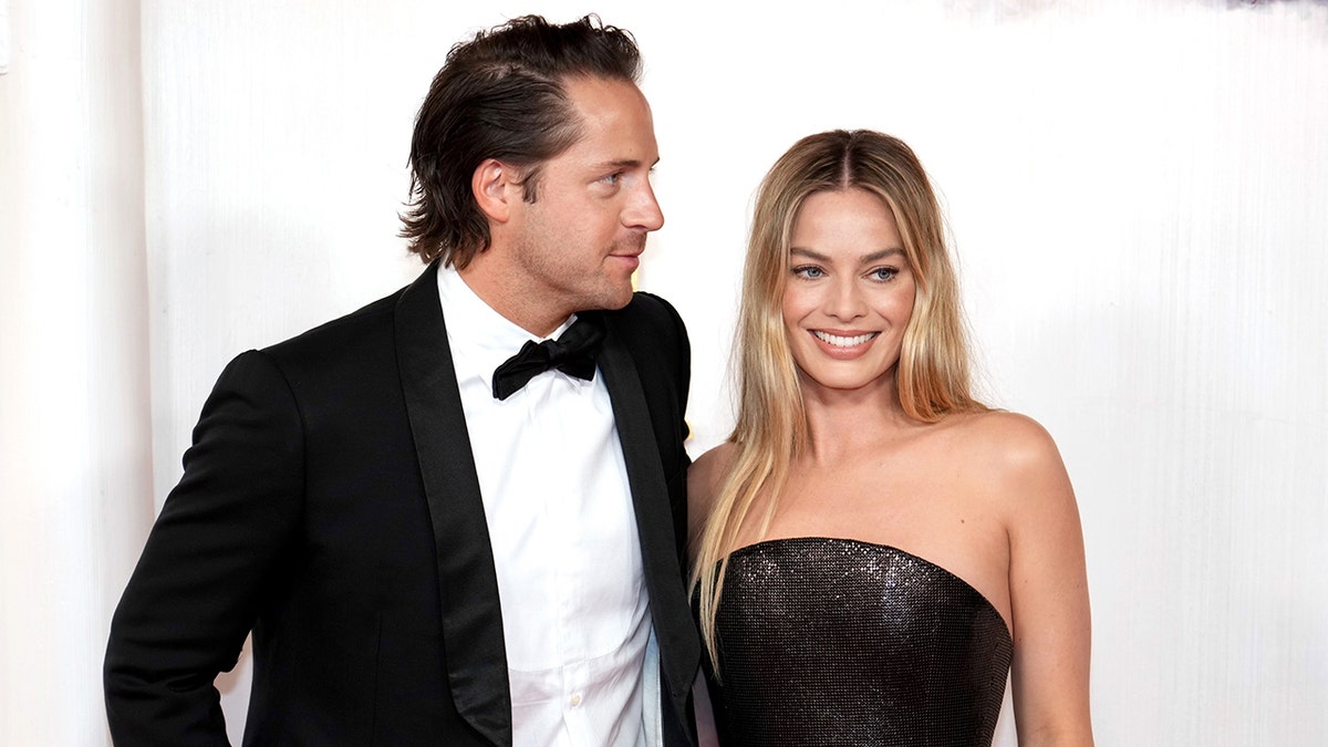 Tom Ackerley and Margot Robbie