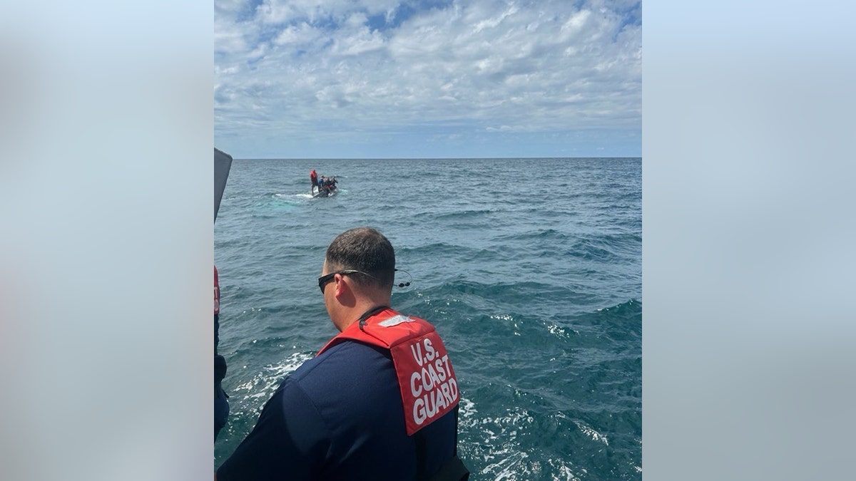Coast Guard crew spotting capsized boat