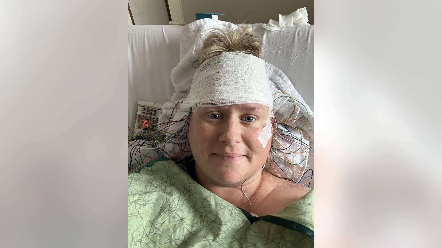 Carrie Robinette recovers in the hospital as she worked to get her SPS diagnosis scaled