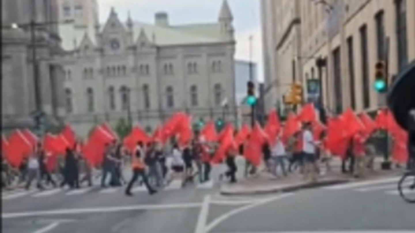 Communists March on the Streets of Philadelphia, Chanting for Revolution