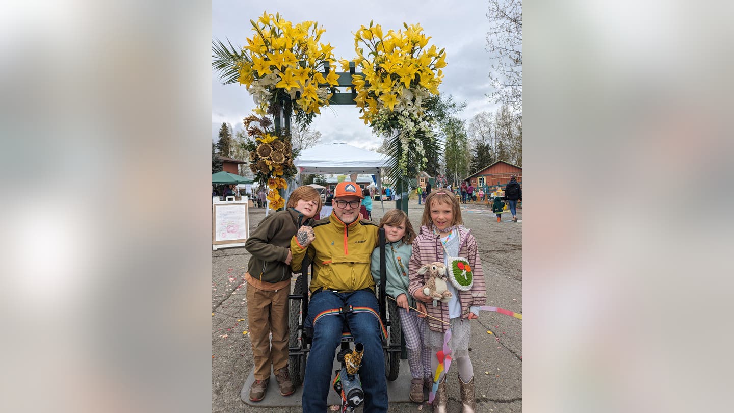 Corwyn Wilkey poses with his family in Alaska scaled