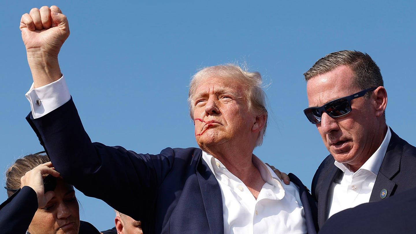 Photographer Captures Iconic Image of Bullet Whizzing Past Trump at Rally