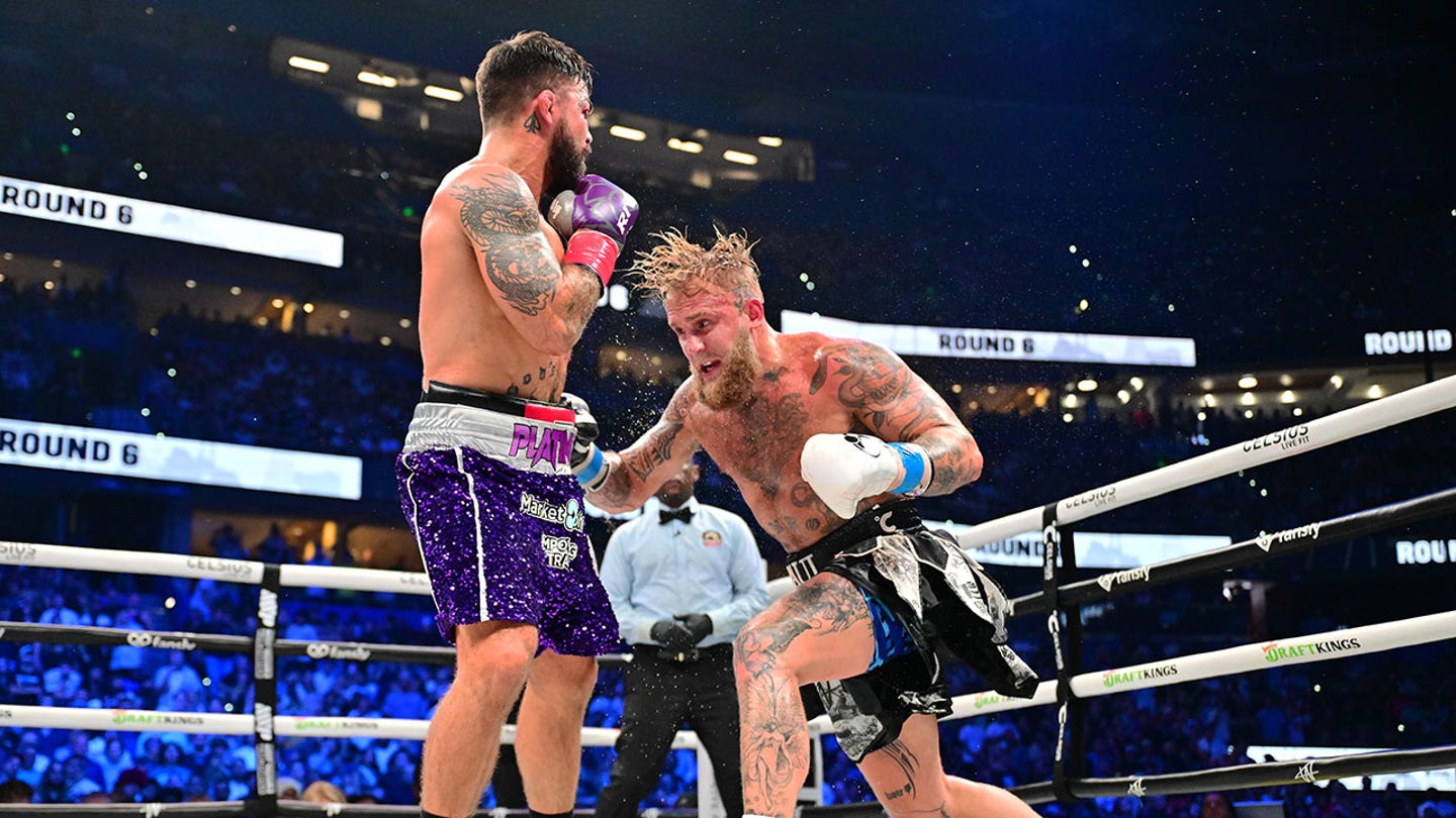 Jake Paul Triumphs over Iron-Jawed Mike Perry in Hard-Fought Boxing Match