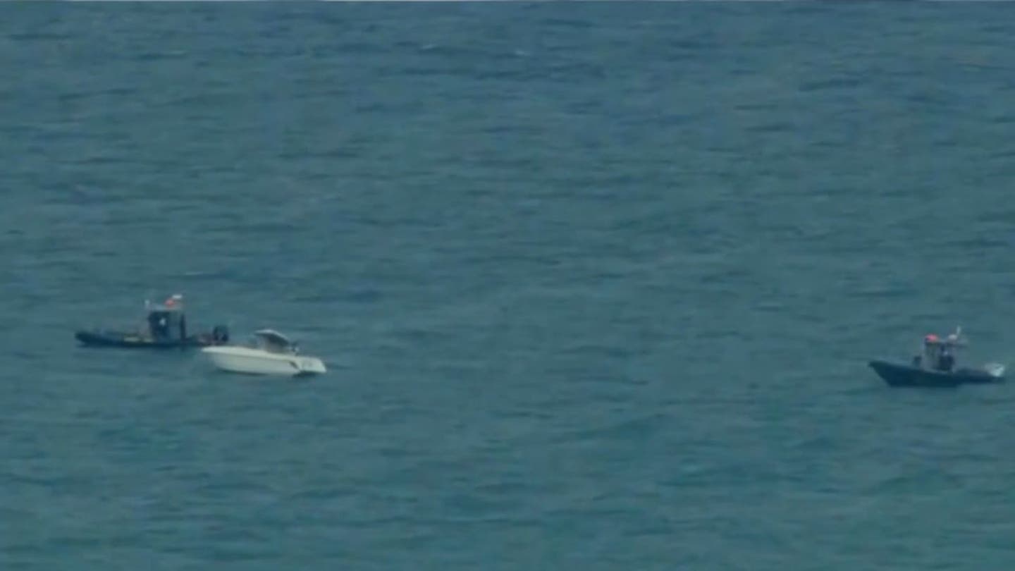 Rescuers Resume Search for Two Swimmers Missing in Lake Michigan