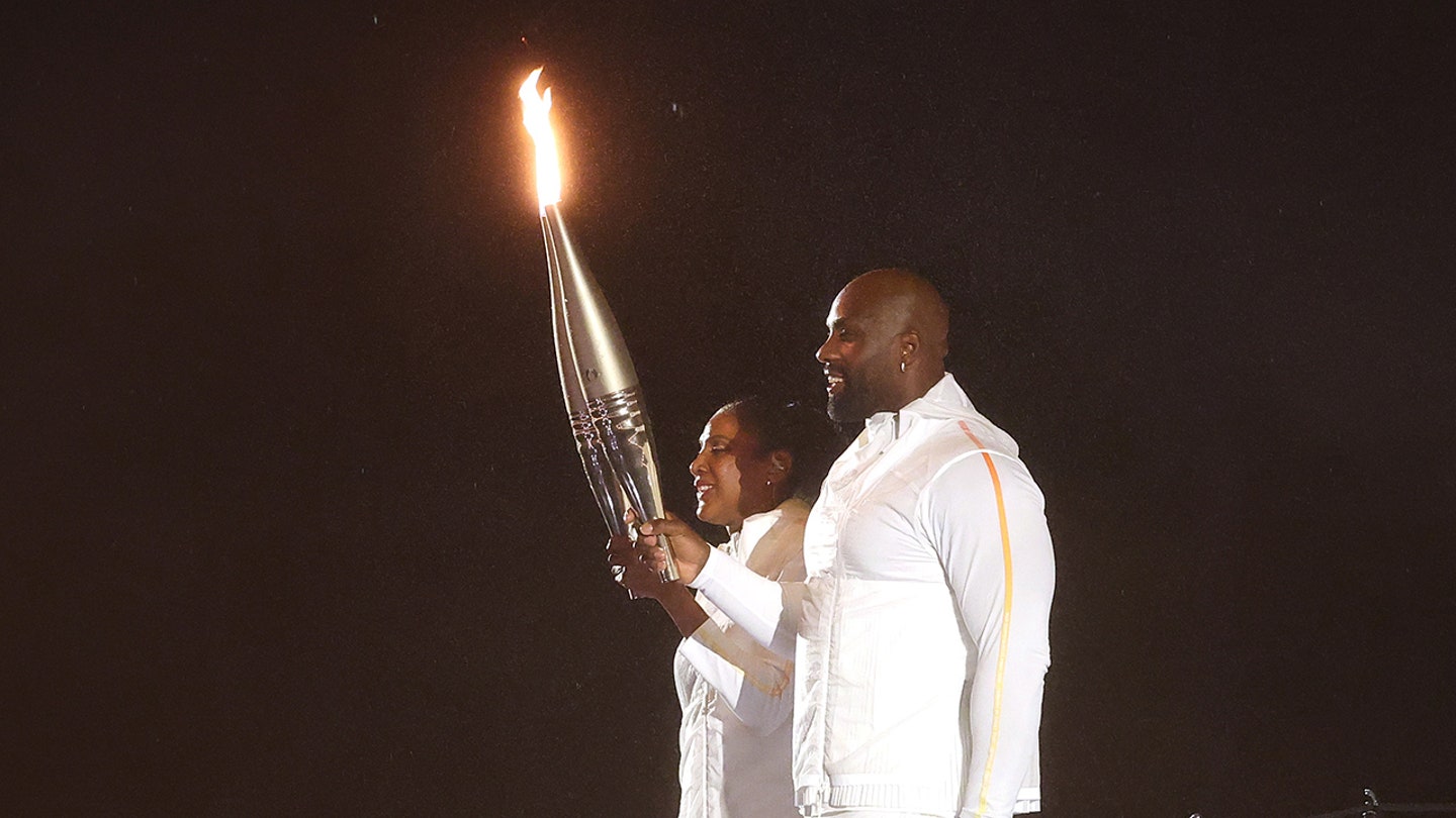 Lighting the Olympic Flame: French Legends Pérec and Riner Ignite Paris 2024