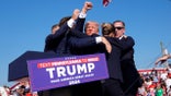 Republican presidential candidate former President Donald Trump is surrounded by U.S. Secret Service agents at a campaign rally