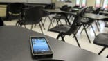 Photo Illustration - A smart phone on a desk in a classroom at the UAlbany campus on Monday, Aug. 26, 2013 in Albany, NY. (Photo by Paul Buckowski/Albany Times Union via Getty Images)