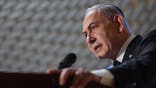 Israeli Prime Minister Benjamin Netanyahu speaks during a commemoration ceremony for soldiers killed during the 2014 Gaza war, also known as Operation Protective Edge, at the Memorial Hall on Mount Herzl in Jerusalem on July 16, 2024. (Photo by ABIR SULTAN / POOL / AFP) (Photo by ABIR SULTAN/POOL/AFP via Getty Images)