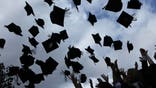 BIRMINGHAM, ENGLAND - JULY 14:  Students throw their mortarboards in the air during their graduation photograph at the University of Birmingham degree congregations  on July 14, 2009 in Birmingham, England. Over 5000 graduates will be donning their robes this week to collect their degrees from The University of Birmingham. A recent survey suggested that there are 48 graduates competing for every job.  (Photo by Christopher Furlong/Getty Images)