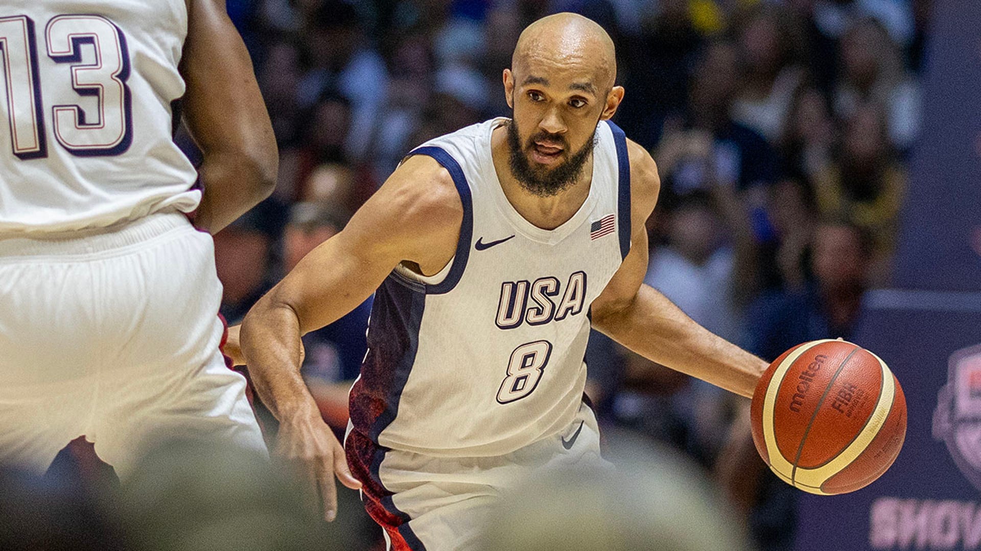 Derrick White dribbles