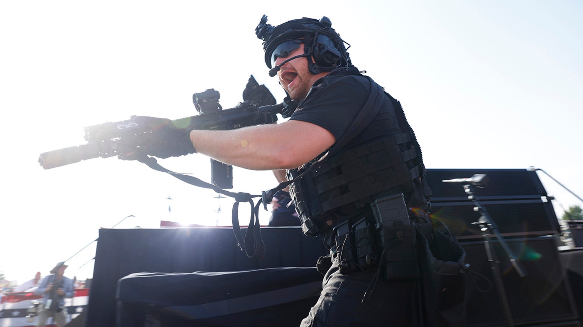 A law enforcement officer move during republican presidential candidate former President Donald Trump's rally