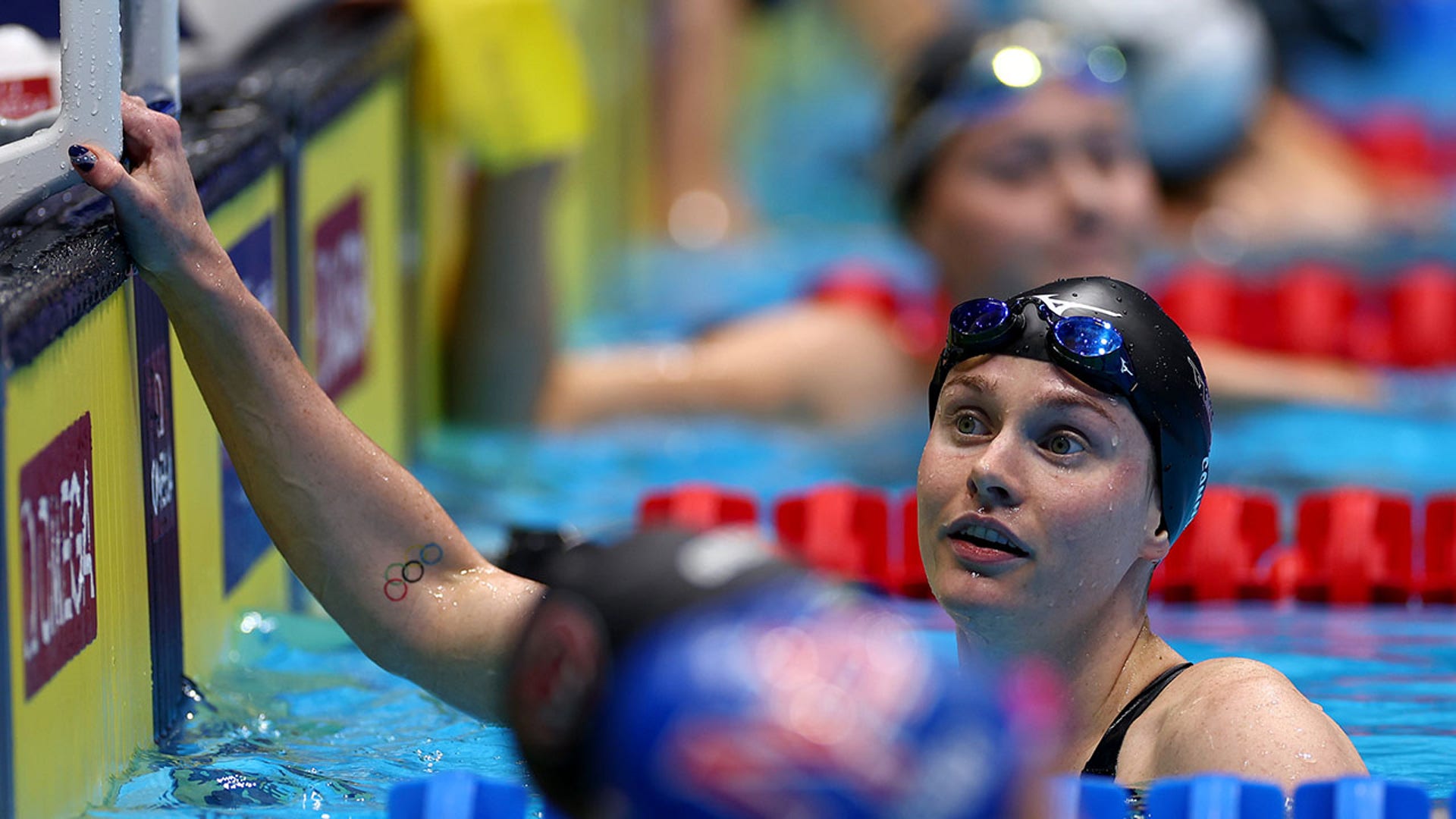 Erika Connolly looks on