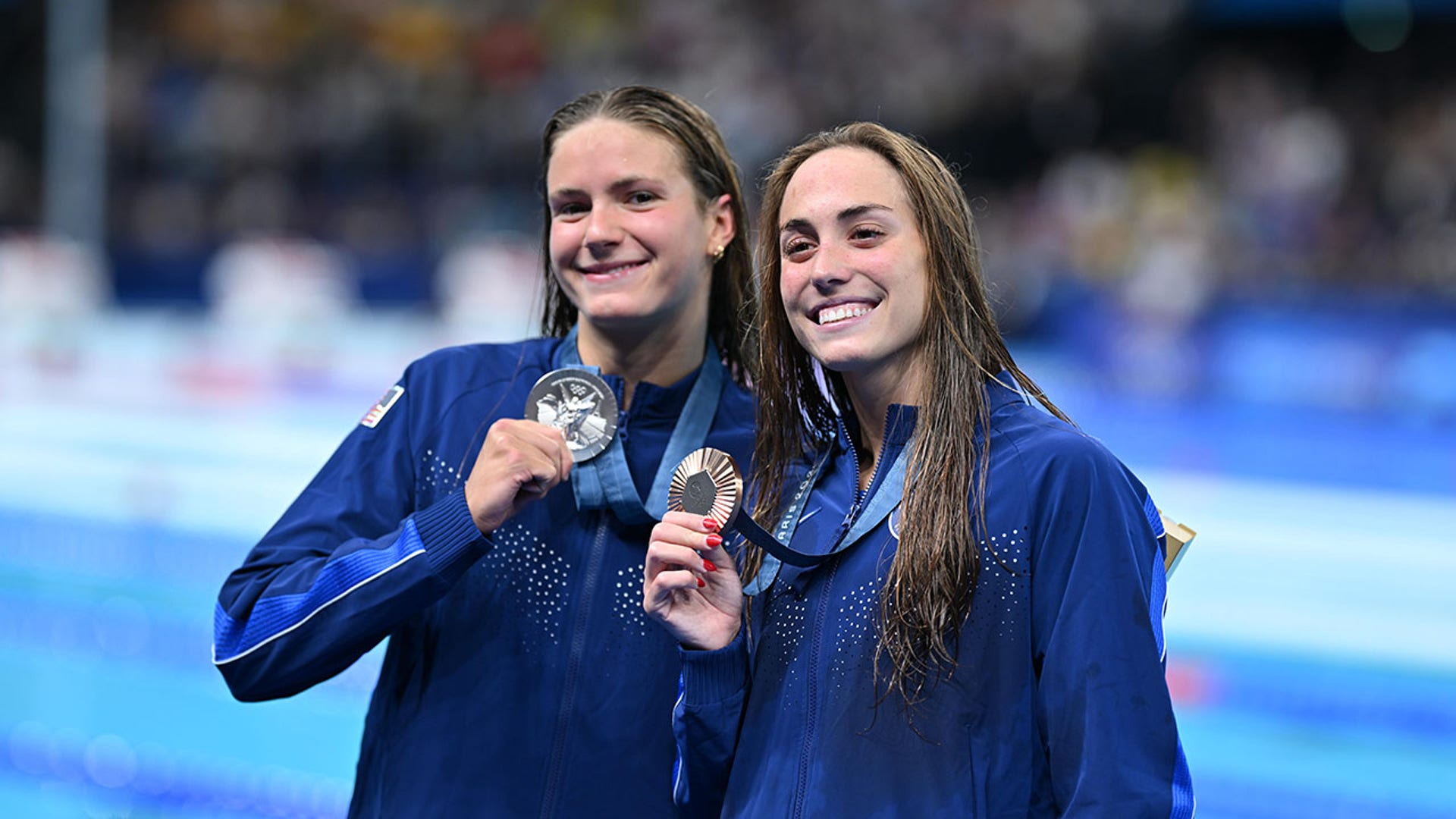 Katie Grimes and Emma Weyant pose