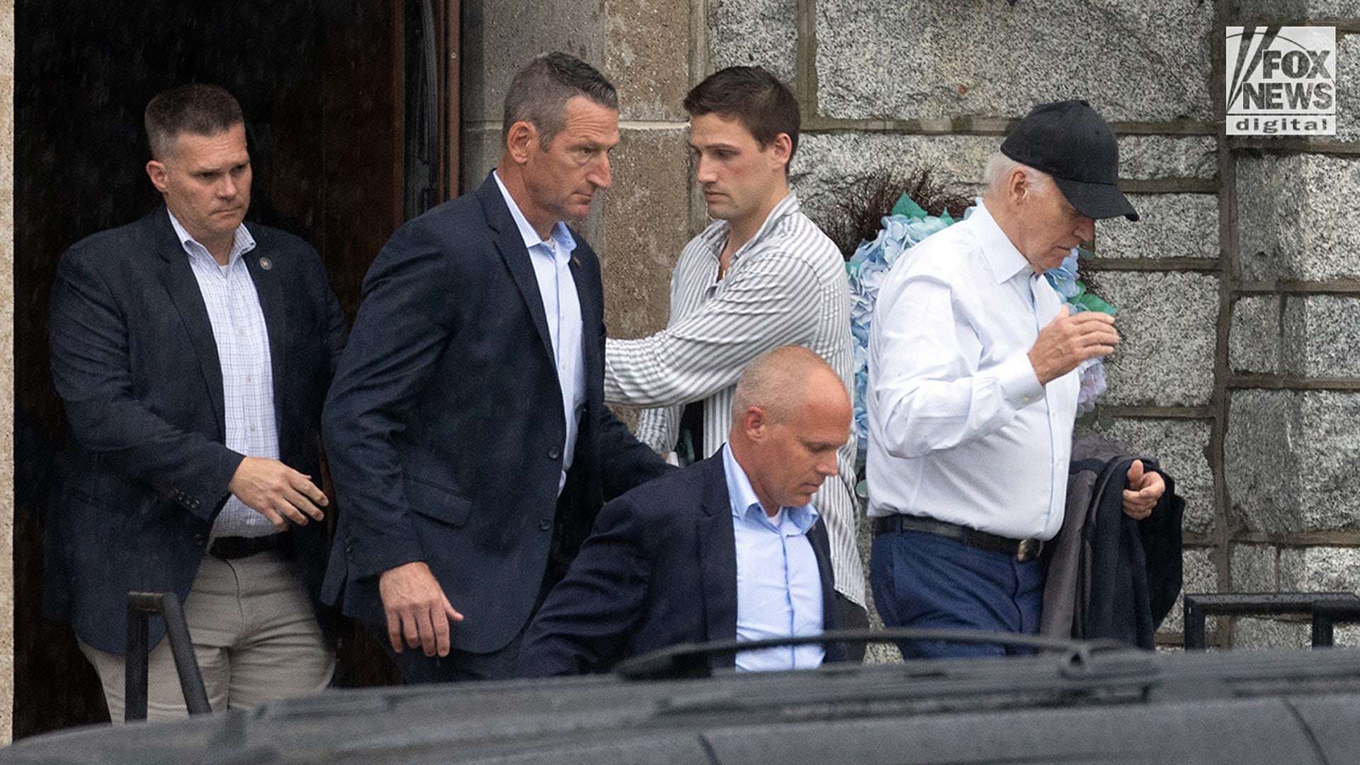 Biden exits St. Edmond’s Catholic Church after attending mass