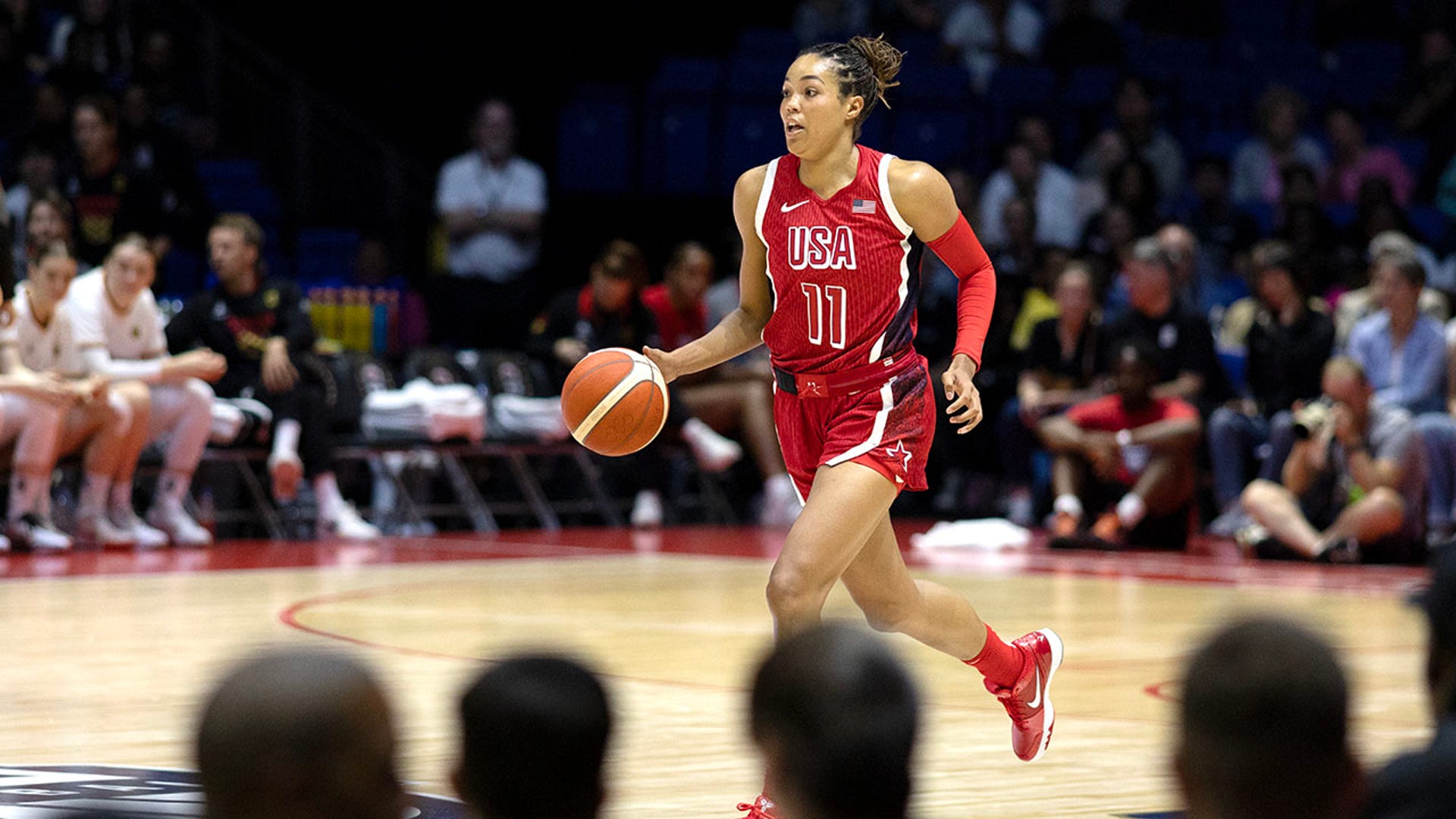 Napheesa Collier dribbles