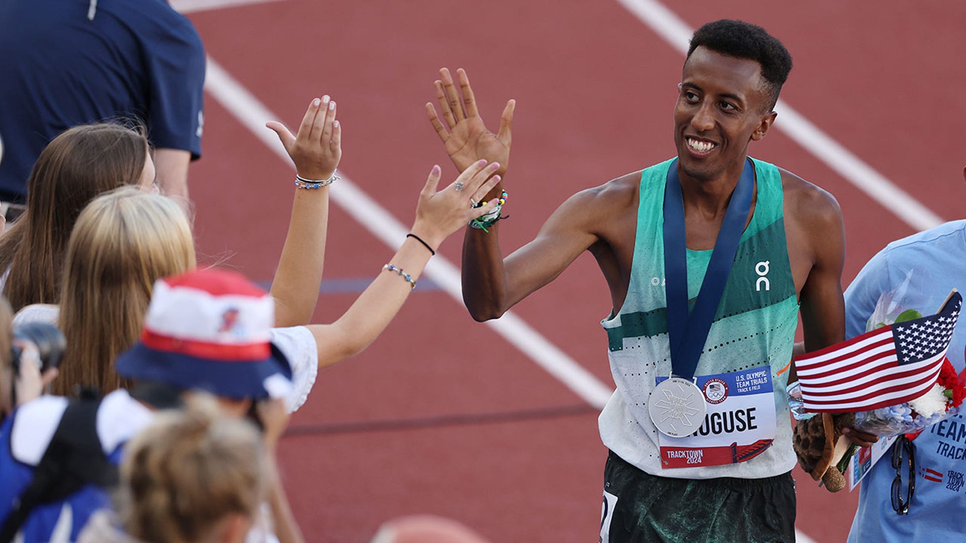 Yared Nuguse celebrates