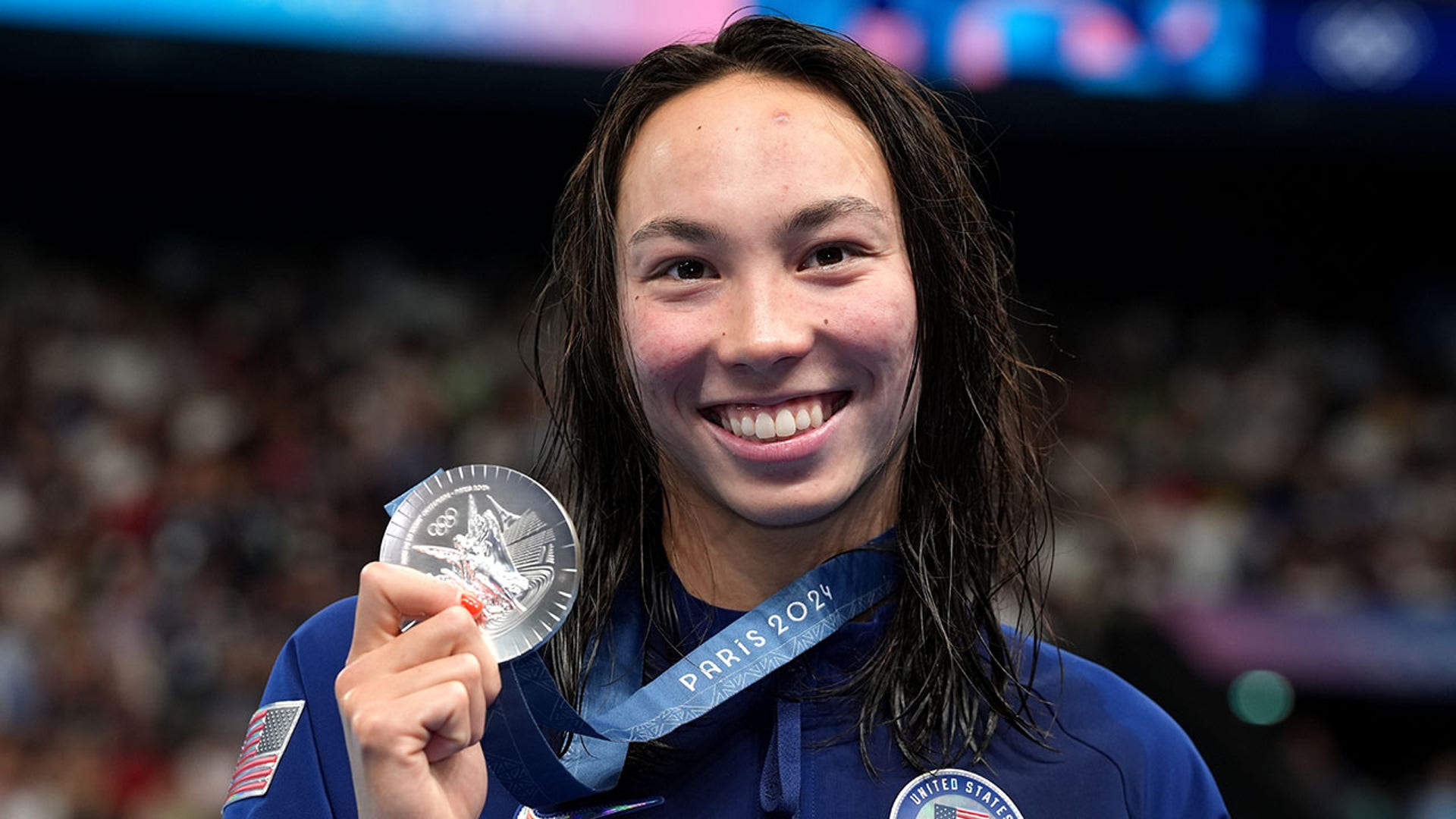 USA's Torri Huske poses with her silver medal after the women's 100m freestyle final at the Paris La Defense Arena on the fifth day of the 2024 Paris Olympic Games in France.