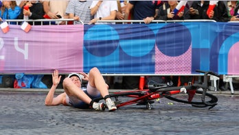 Paris streets littered by bicycle crashes during Olympics triathlon amid wet conditions