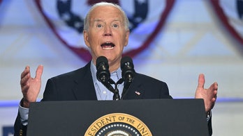 Biden's 'Pass the Torch, Joe' Sign Holder Draws Attention Amid Gaffe-Prone Rally