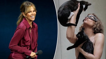 Halle Berry poses topless with her cats to celebrate 20th anniversary of 'Catwoman'