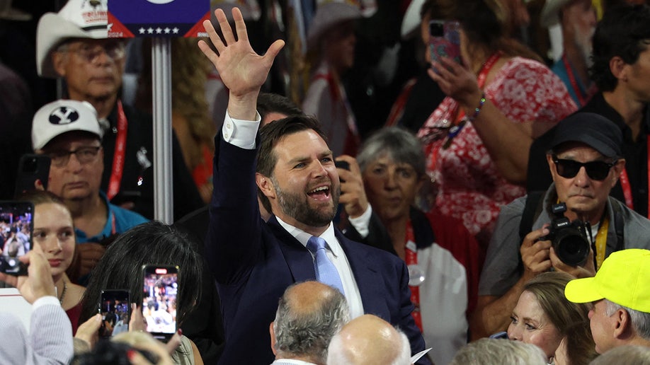 J.D. Vance is greeted by supporters as he arrives for Day 1 of the Republican National Convention