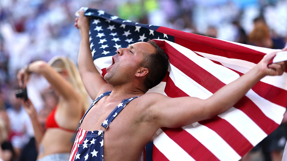 USA fan waves flag