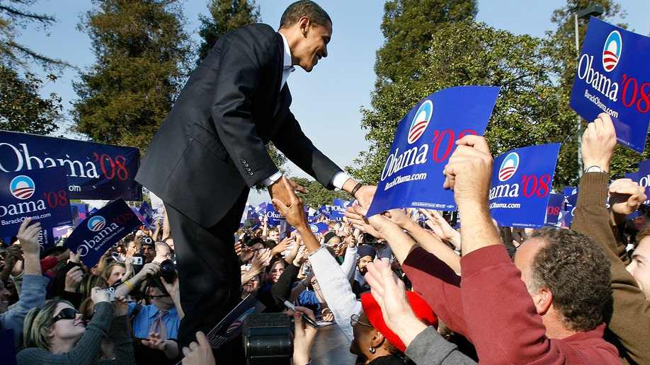 Barack Obama greeting supporters at rally
