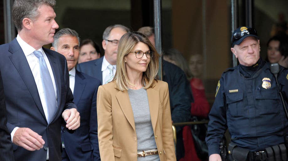 Lori Loughlin exiting courthouse amid college admissions scandal