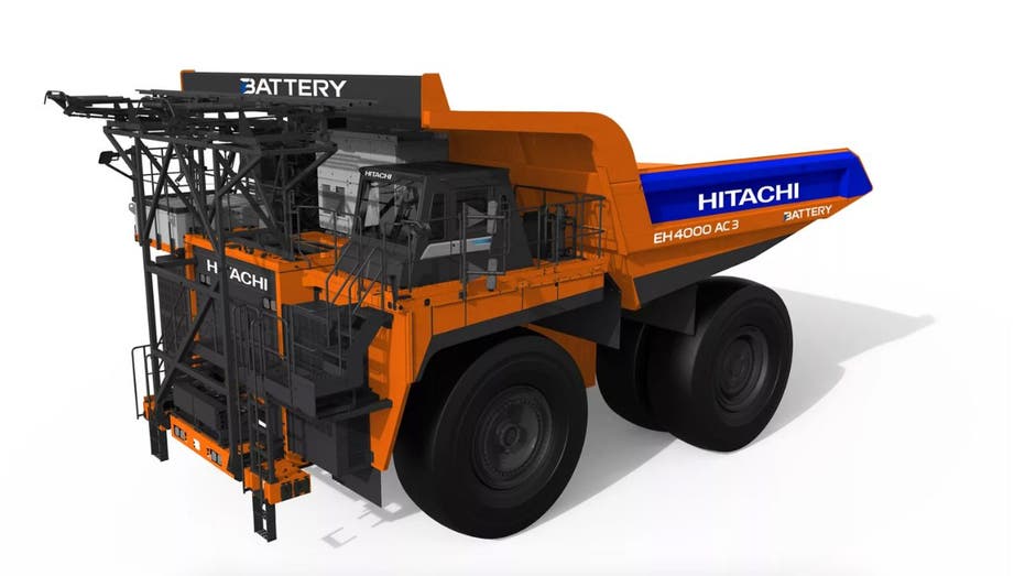 Giant battery-powered dump truck dumps diesel for electric