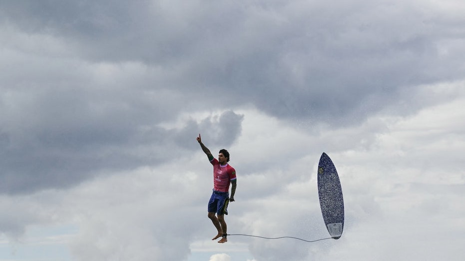 Brazilian surfer hovers above ocean in viral photo, breaks Olympic surfing record