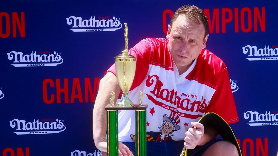 Joey Chestnut shows no rust as he downs 57 hot dogs in competition at Fort Bliss thumbnail