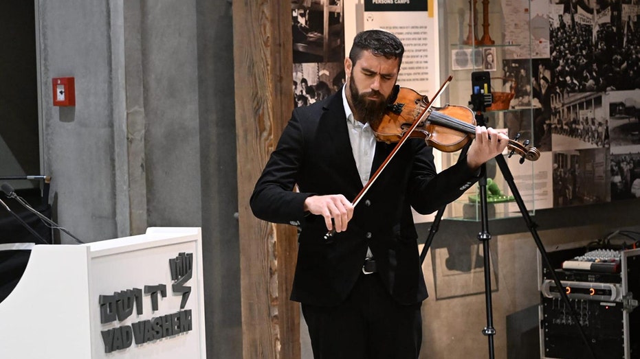 Jewish soldier, wounded in war, memorializes young Holocaust hero by playing his violin