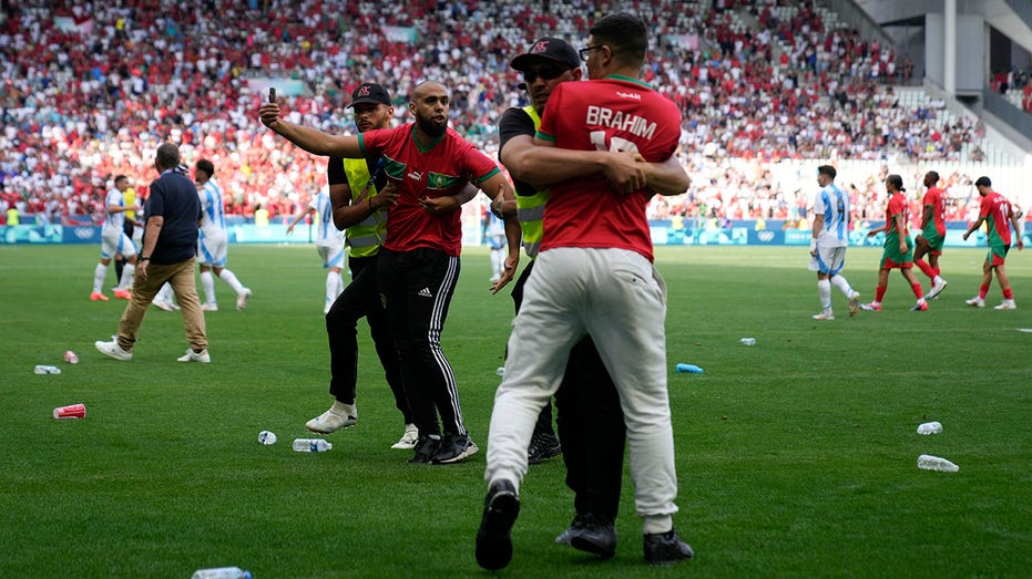 Paris Olympics men's soccer play begins with chaotic Morocco win as fans storm and trash field