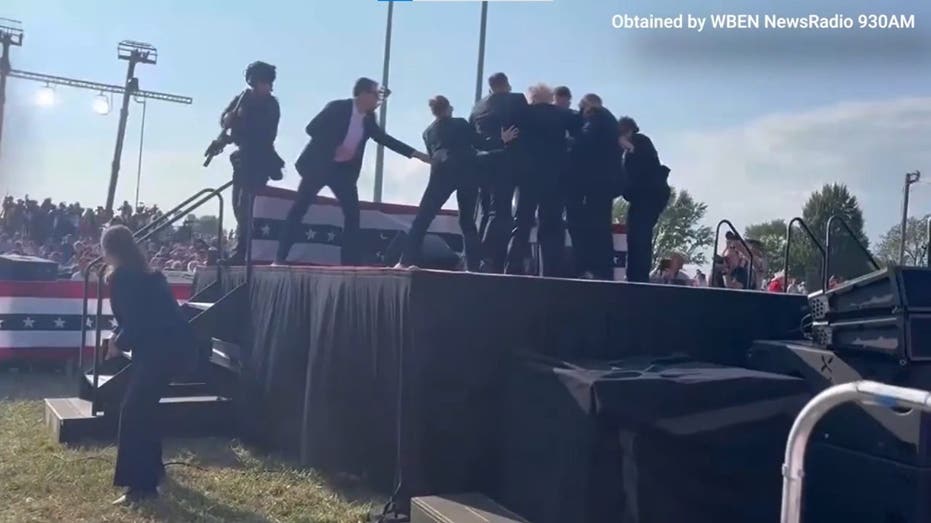 Video shows moment Secret Service agents tossed Trump’s shoes offstage