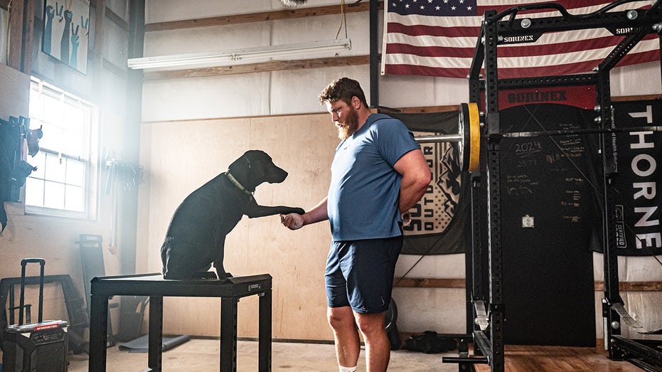 Olympic gold medalist Ryan Crouser relies on Labrador, Koda, to stay grounded amid immense pressure