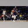Bam Adebayo dribbles