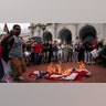 Pro-Palestinian demonstrators burn a U.S. flag