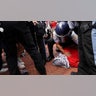 Police detain a pro-Palestinian demonstrator